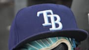 Sep 26, 2025; Toronto, Ontario, CAN; The hat and glove of Tampa Bay Rays third baseman Junior Caminero (13) in the dugout during the game against the Toronto Blue Jays at Rogers Centre. 
