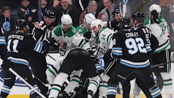 Dec 23, 2024; Salt Lake City, Utah, USA; The Utah Hockey Club and Dallas Stars fight during the third period at Delta Center. Mandatory Credit: Rob Gray-Imagn Images