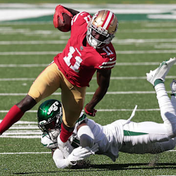 Sep 20, 2020; East Rutherford, New Jersey, USA; San Francisco 49ers wide receiver Brandon Aiyuk (11) is tackled by New York Jets safety Matthias Farley (41) during the second half at MetLife Stadium. Mandatory Credit: Vincent Carchietta-Imagn Images 