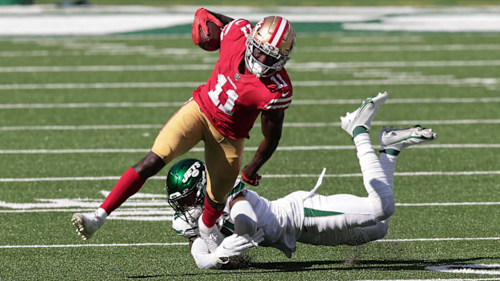 Sep 20, 2020; East Rutherford, New Jersey, USA; San Francisco 49ers wide receiver Brandon Aiyuk (11) is tackled by New York Jets safety Matthias Farley (41) during the second half at MetLife Stadium. Mandatory Credit: Vincent Carchietta-Imagn Images 