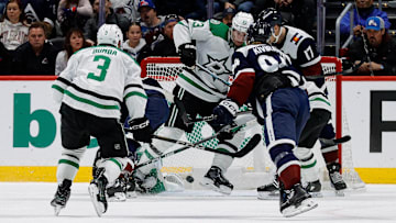 Jan 18, 2025; Denver, Colorado, USA; Dallas Stars defenseman Esa Lindell (23) blocks a shot with his skate as Colorado Avalanche center Parker Kelly (17) and left wing Joel Kiviranta (94) and defenseman Mathew Dumba (3) look on in the third period at Ball Arena. Mandatory Credit: Isaiah J. Downing-Imagn Images