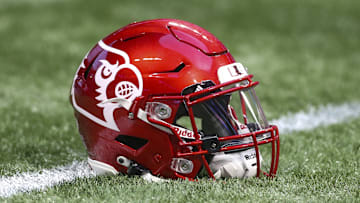 Sep 6, 2021; Atlanta, Georgia, USA; Detailed view of a Louisville Cardinals helmet on the field before a game against the Mississippi Rebels at Mercedes-Benz Stadium. Mandatory Credit: Brett Davis-Imagn Images