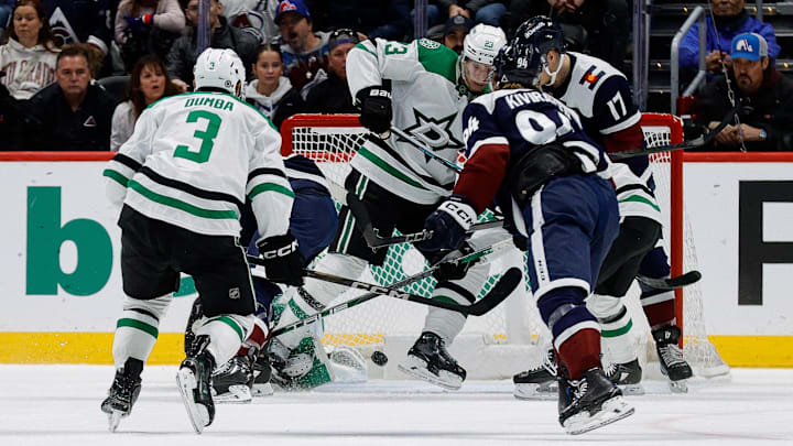 Jan 18, 2025; Denver, Colorado, USA; Dallas Stars defenseman Esa Lindell (23) blocks a shot with his skate as Colorado Avalanche center Parker Kelly (17) and left wing Joel Kiviranta (94) and defenseman Mathew Dumba (3) look on in the third period at Ball Arena. Mandatory Credit: Isaiah J. Downing-Imagn Images