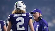 Dec 26, 2024; Phoenix, AZ, USA; Kansas State Wildcats head coach Chris Klieman with quarterback Avery Johnson (2) against the Rutgers Scarlet Knights during the Rate Bowl at Chase Field. Mandatory Credit: Mark J. Rebilas-Imagn Images