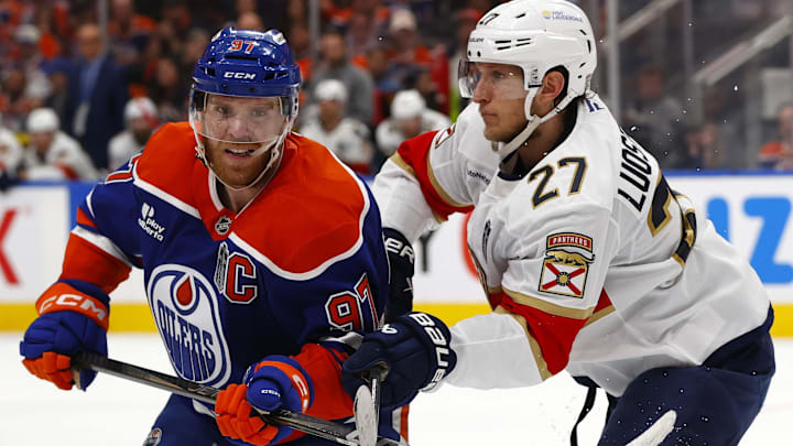 Edmonton Oilers center Connor McDavid skates past Florida Panthers center Eetu Luostarinen Edmonton Oilers center Connor McDavid skates past Florida Panthers center Eetu Luostarinen