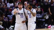 Apr 10, 2024; Miami, Florida, USA; Dallas Mavericks guard Luka Doncic (77) talks to forward Derrick