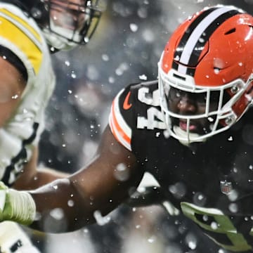 Nov 21, 2024; Cleveland, Ohio, USA; Cleveland Browns defensive tackle Dalvin Tomlinson (94) grabs the jersey of Pittsburgh Steelers quarterback Russell Wilson (3) during the second half at Huntington Bank Field. Mandatory Credit: Ken Blaze-Imagn Images