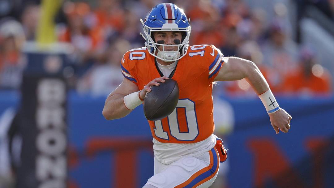 Jan 4, 2026; Denver, Colorado, USA; Denver Broncos quarterback Bo Nix (10) runs with the ball against the Los Angeles Chargers during the first half at Empower Field at Mile High. Jan 4, 2026; Denver, Colorado, USA; Denver Broncos quarterback Bo Nix (10) runs with the ball against the Los Angeles Chargers during the first half at Empower Field at Mile High.