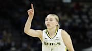 Dallas Wings guard Paige Bueckers reacts to scoring a basket.
