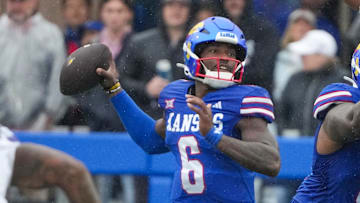 Oct 25, 2025; Lawrence, Kansas, USA; Kansas Jayhawks quarterback Jalon Daniels (6) throws a pass against the Kansas State Wildcats during the first half of the game at David Booth Kansas Memorial Stadium. Mandatory Credit: Denny Medley-Imagn Images