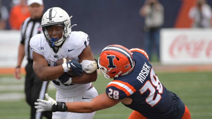 Sep 16, 2023; Champaign, Illinois, USA;  Penn State Nittany Lions running back Kaytron Allen (13) is tackled by Illinois Fighting Illini linebacker Dylan Rosiek (28) during the second half at Memorial Stadium. Mandatory Credit: Ron Johnson-USA TODAY Sports