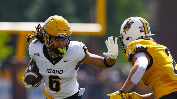 Sep 7, 2024; Laramie, Wyoming, USA; Idaho Vandals wide receiver Jordan Dwyer (6) stiff arms Wyoming Cowboys nose guard Wrook Brown (2) during the first quarter at Jonah Field at War Memorial Stadium. Mandatory Credit: Troy Babbitt-Imagn Images Sep 7, 2024; Laramie, Wyoming, USA; Idaho Vandals wide receiver Jordan Dwyer (6) stiff arms Wyoming Cowboys nose guard Wrook Brown (2) during the first quarter at Jonah Field at War Memorial Stadium. Mandatory Credit: Troy Babbitt-Imagn Images