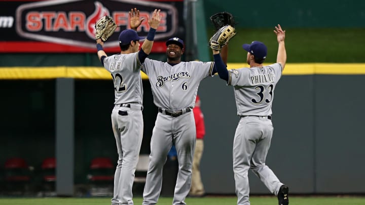 May 1, 2018; Cincinnati, OH, USA; Milwaukee Brewers left fielder Christian Yelich (22), center fielder Lorenzo Cain (6), and right fielder Brett Phillips (33) celebrate after defeating the Cincinnati Reds at Great American Ball Park. Mandatory Credit: Aaron Doster-USA TODAY Sports