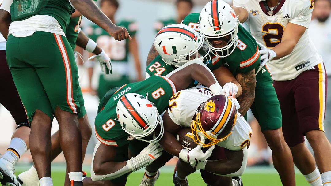 Sep 26, 2026; Miami Gardens, Florida, USA; Miami Hurricanes defensive end Herbert Scroggins III (31) is tackled by Miami Hurricanes linebacker Chase Smith (9), Miami Hurricanes defensive back Ethan O'Connor (24) and Miami Hurricanes defensive lineman Marquise Lightfoot (8) during the first quarter at Hard Rock Stadium. Mandatory Credit: Sam Navarro-Imagn Images Sep 26, 2026; Miami Gardens, Florida, USA; Miami Hurricanes defensive end Herbert Scroggins III (31) is tackled by Miami Hurricanes linebacker Chase Smith (9), Miami Hurricanes defensive back Ethan O'Connor (24) and Miami Hurricanes defensive lineman Marquise Lightfoot (8) during the first quarter at Hard Rock Stadium. Mandatory Credit: Sam Navarro-Imagn Images