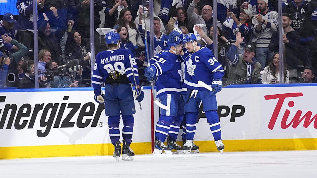 Apr 20, 2025; Toronto, Ontario, CAN; Toronto Maple Leafs forward Auston Matthews (34) congratulates forward John Tavares (91) on his goal against the Ottawa Senators during the second period of game one of the first round of the 2025 Stanley Cup Playoffs at Scotiabank Arena. Mandatory Credit: John E. Sokolowski-Imagn Images