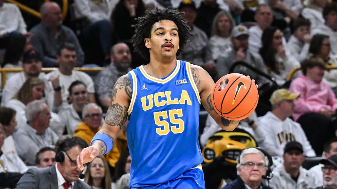 Jan 3, 2026; Iowa City, Iowa, USA; UCLA Bruins guard Skyy Clark (55) controls the ball against the Iowa Hawkeyes during the first half at Carver-Hawkeye Arena. Mandatory Credit: Jeffrey Becker-Imagn Images