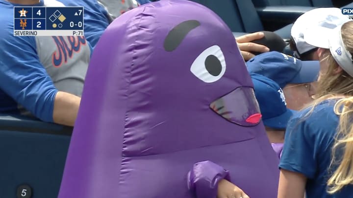 An inflatable Grimace at a Mets game.