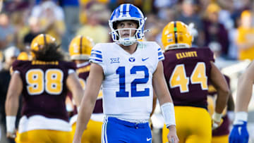 Nov 23, 2024; Tempe, Arizona, USA; Brigham Young Cougars quarterback Jake Retzlaff (12) reacts against the Arizona State Sun Devils in the second half at Mountain America Stadium. 