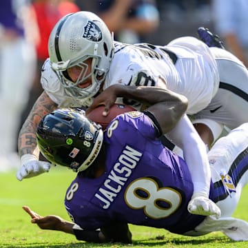 Sep 15, 2024; Baltimore, Maryland, USA; Las Vegas Raiders defensive end Maxx Crosby (98) sacks Baltimore Ravens quarterback Lamar Jackson (8) during the second half at M&T Bank Stadium. Mandatory Credit: Reggie Hildred-Imagn Images