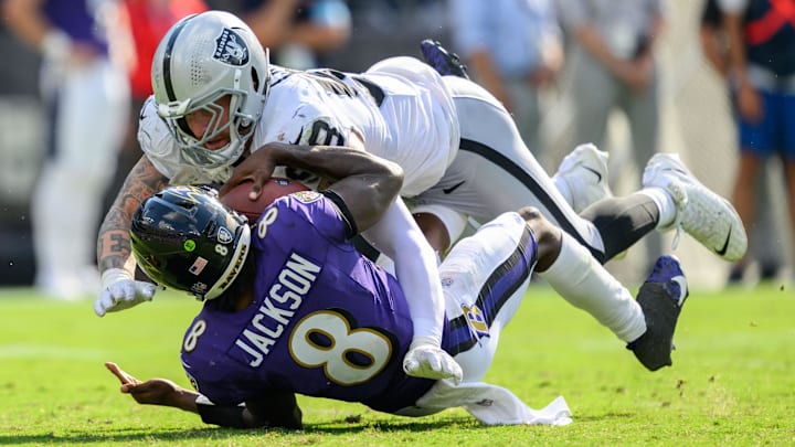 Las Vegas Raiders defensive end Maxx Crosby (98) sacks Baltimore Ravens quarterback Lamar Jackson. 