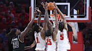 Dec 10, 2025; Houston, Texas, USA; Houston Cougars forward Joseph Tugler (11) and guard Mercy Miller (25) and forward Chris Cenac Jr. (5) attempt to get a rebound away from Jackson State Tigers forward Raevon Thomas (20) during the first half at Fertitta Center. Mandatory Credit: Troy Taormina-Imagn Images
