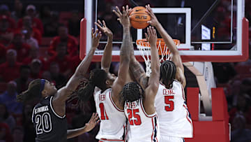 Dec 10, 2025; Houston, Texas, USA; Houston Cougars forward Joseph Tugler (11) and guard Mercy Miller (25) and forward Chris Cenac Jr. (5) attempt to get a rebound away from Jackson State Tigers forward Raevon Thomas (20) during the first half at Fertitta Center. Mandatory Credit: Troy Taormina-Imagn Images
