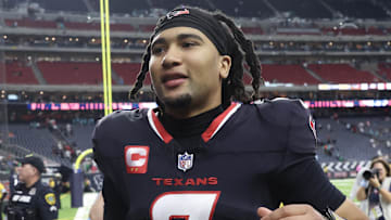 Dec 15, 2024; Houston, Texas, USA; Houston Texans quarterback C.J. Stroud (7) runs off the field after defeating the Miami Dolphins at NRG Stadium. Mandatory Credit: Thomas Shea-Imagn Images