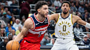 Apr 8, 2025; Indianapolis, Indiana, USA; Washington Wizards guard Colby Jones (1) dribbles the ball while  Indiana Pacers guard Tyrese Haliburton (0) defends in the second half at Gainbridge Fieldhouse. Mandatory Credit: Trevor Ruszkowski-Imagn Images