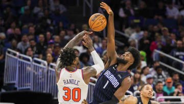 Feb 7, 2023; Orlando, Florida, USA; Orlando Magic forward Jonathan Isaac (1) blocks a shot by New York Knicks forward Julius Randle (30) during the second half at Amway Center. Mandatory Credit: Mike Watters-USA TODAY Sports