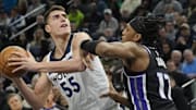 Feb 3, 2025; Minneapolis, Minnesota, USA; Minnesota Timberwolves forward Luka Garza (55) shoots over Sacramento Kings forward Isaac Jones (17) in the first quarter at Target Center. Mandatory Credit: Bruce Kluckhohn-Imagn Images