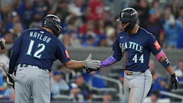 Oct 20, 2025; Toronto, Ontario, CAN; Seattle Mariners center fielder Julio Rodriguez (44) celebrates with first baseman Josh Naylor (12) after hitting a home run in the third inning against the Toronto Blue Jays during game seven of the ALCS round for the 2025 MLB playoffs at Rogers Centre.