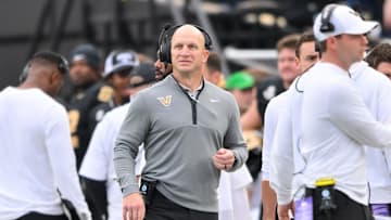 Nov 22, 2025; Nashville, Tennessee, USA;  Vanderbilt Commodores head coach Clark Lea checks the video board against the Kentucky Wildcats during the first half at FirstBank Stadium. Mandatory Credit: Steve Roberts-Imagn Images