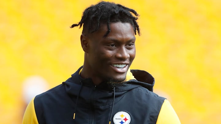 Pittsburgh Steelers wide receiver George Pickens smiles on the field before the game against the New England Patriots. Pittsburgh Steelers wide receiver George Pickens smiles on the field before the game against the New England Patriots.