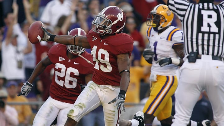 November 8, 2008; Baton Rouge, LA, USA; Alabama Crimson Tide defensive back Rashad Johnson (49) carries the ball into the endzone after intercepting the ball from the LSU Tigers during the first half at Tiger Stadium in Baton Rouge. Mandatory Credit: Crystal LoGiudice-USA TODAY Sports