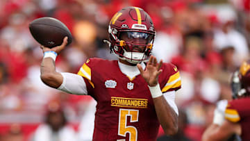 Sep 8, 2024; Tampa, Florida, USA; Washington Commanders quarterback Jayden Daniels (5) drops back to pass against the Tampa Bay Buccaneers in the third quarter at Raymond James Stadium. Mandatory Credit: Nathan Ray Seebeck-Imagn Images