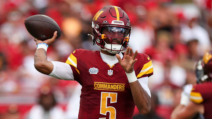 Sep 8, 2024; Tampa, Florida, USA; Washington Commanders quarterback Jayden Daniels (5) drops back to pass against the Tampa Bay Buccaneers in the third quarter at Raymond James Stadium. Mandatory Credit: Nathan Ray Seebeck-Imagn Images