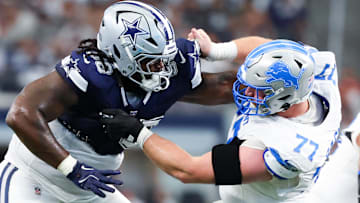 Oct 13, 2024; Arlington, Texas, USA;  Dallas Cowboys defensive tackle Mazi Smith (58) and Detroit Lions center Frank Ragnow (77) battle during the second quarter at AT&T Stadium.