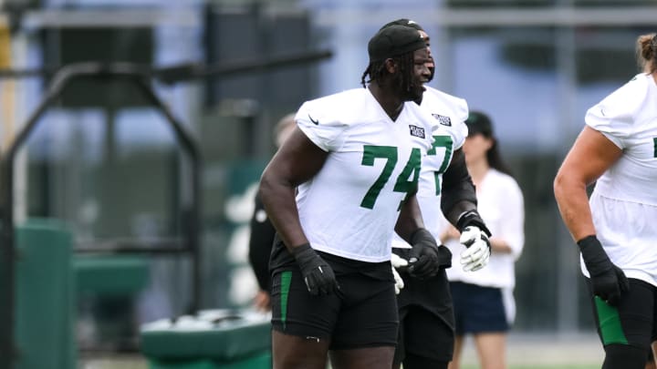 Jul 25, 2024; Florham Park, NJ, USA; New York Jets offensive tackle Olu Fashanu (74) warms up during training camp at Atlantic Health Jets Training Center. 