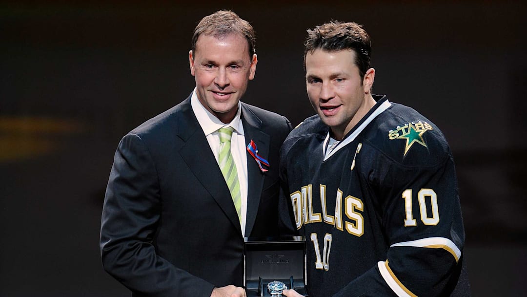 Oct 29, 2011; Dallas, TX, USA; Dallas Stars general manager Joe Nieuwendyk (left) and left wing Brenden Morrow (10) participate in pre-game ceremonies before the game against the New Jersey Devils at the American Airlines Center. The Stars defeated the Devils 3-1. Mandatory Credit: Jerome Miron-Imagn Images