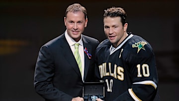 Oct 29, 2011; Dallas, TX, USA; Dallas Stars general manager Joe Nieuwendyk (left) and left wing Brenden Morrow (10) participate in pre-game ceremonies before the game against the New Jersey Devils at the American Airlines Center. The Stars defeated the Devils 3-1. Mandatory Credit: Jerome Miron-Imagn Images