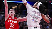 Sep 11, 2024; Indianapolis, Indiana, USA; Las Vegas Aces center A'ja Wilson (22) blocks Indiana Fever guard Caitlin Clark (22) on Wednesday, Sept. 11, 2024, during a game between the Indiana Fever and the Las Vegas Aces at Gainbridge Fieldhouse in Indianapolis. The Aces defeated the Fever, 86-75. Mandatory Credit: Grace Smith