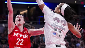 Sep 11, 2024; Indianapolis, Indiana, USA; Las Vegas Aces center A'ja Wilson (22) blocks Indiana Fever guard Caitlin Clark (22) on Wednesday, Sept. 11, 2024, during a game between the Indiana Fever and the Las Vegas Aces at Gainbridge Fieldhouse in Indianapolis. The Aces defeated the Fever, 86-75. Mandatory Credit: Grace Smith