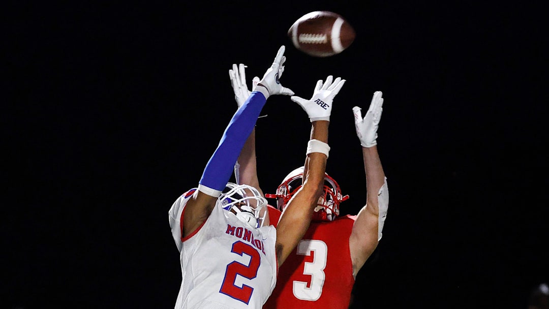 Monroe’s Messiah Amare Hampton breaks up a pass intended for Canandaigua’s Trey Comella.