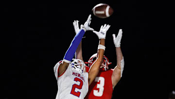 Monroe’s Messiah Amare Hampton breaks up a pass intended for Canandaigua’s Trey Comella.