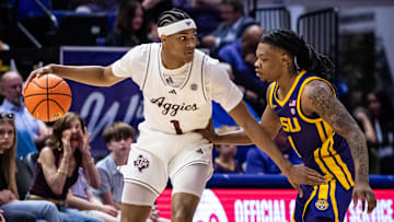 Texas A&M Aggies guard Zhuric Phelps (1) dribbles against LSU Tigers guard Jordan Sears (1) during the first half at Pete Maravich Assembly Center.