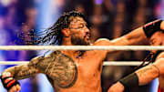 Roman Reigns throws a punch at Jacob Fatu (right) on Saturday, Feb. 1, 2025, during the WWE Royal Rumble at Lucas Oil Stadium in Indianapolis.