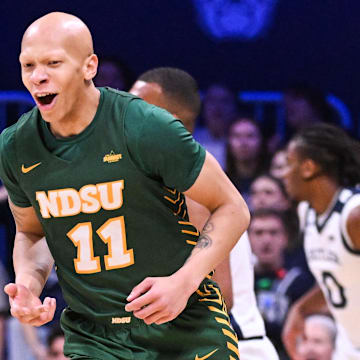 Dec 10, 2024; Indianapolis, Indiana, USA; North Dakota State Bison guard Jacari White (11) celebrates after making a three-point basket during the first half against the Butler Bulldogs at Hinkle Fieldhouse. Mandatory Credit: Robert Goddin-Imagn Images