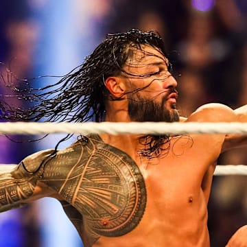 Roman Reigns throws a punch at Jacob Fatu (right) on Saturday, Feb. 1, 2025, during the WWE Royal Rumble at Lucas Oil Stadium in Indianapolis.