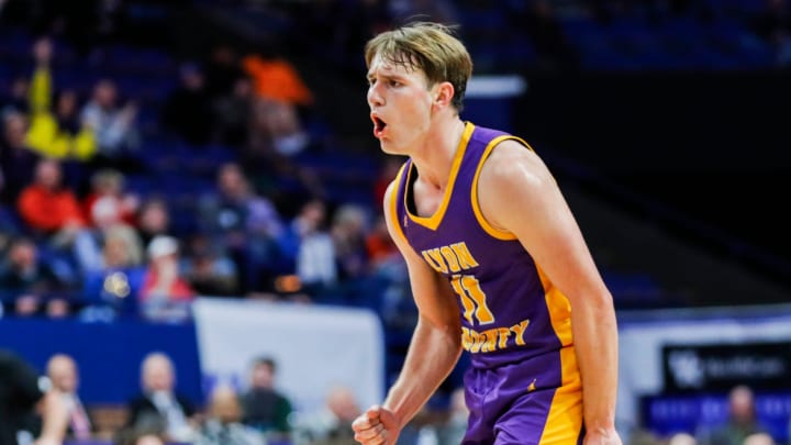 Lyon County's Travis Perry (11) reacts after hitting a clutch three-point shot against Ashland Blazer in the second half at the first round of the 2024 UK Healthcare KHSAA Boys' Sweet 16 in Lexington. The UK signee finished with 16 points and five rebounds with five assists in the Lions' 45-43 win Thursday. March 20, 2024