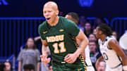 Dec 10, 2024; Indianapolis, Indiana, USA; North Dakota State Bison guard Jacari White (11) celebrates after making a three-point basket during the first half against the Butler Bulldogs at Hinkle Fieldhouse. Mandatory Credit: Robert Goddin-Imagn Images